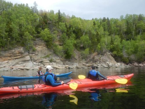 Sea-kayaking-along-the-shoreline-of-Gaspe-Bay-with-Cap-Aventure-outfitters